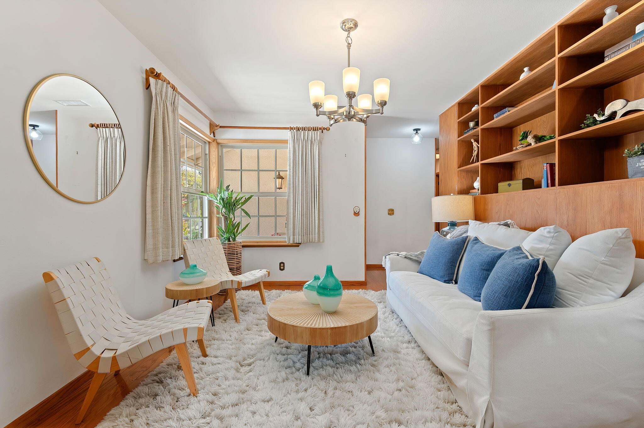 7397 Mirano Drive Goleta, CA 93117 - Photo 13 of 27 a living room with furniture a chandelier and a rug