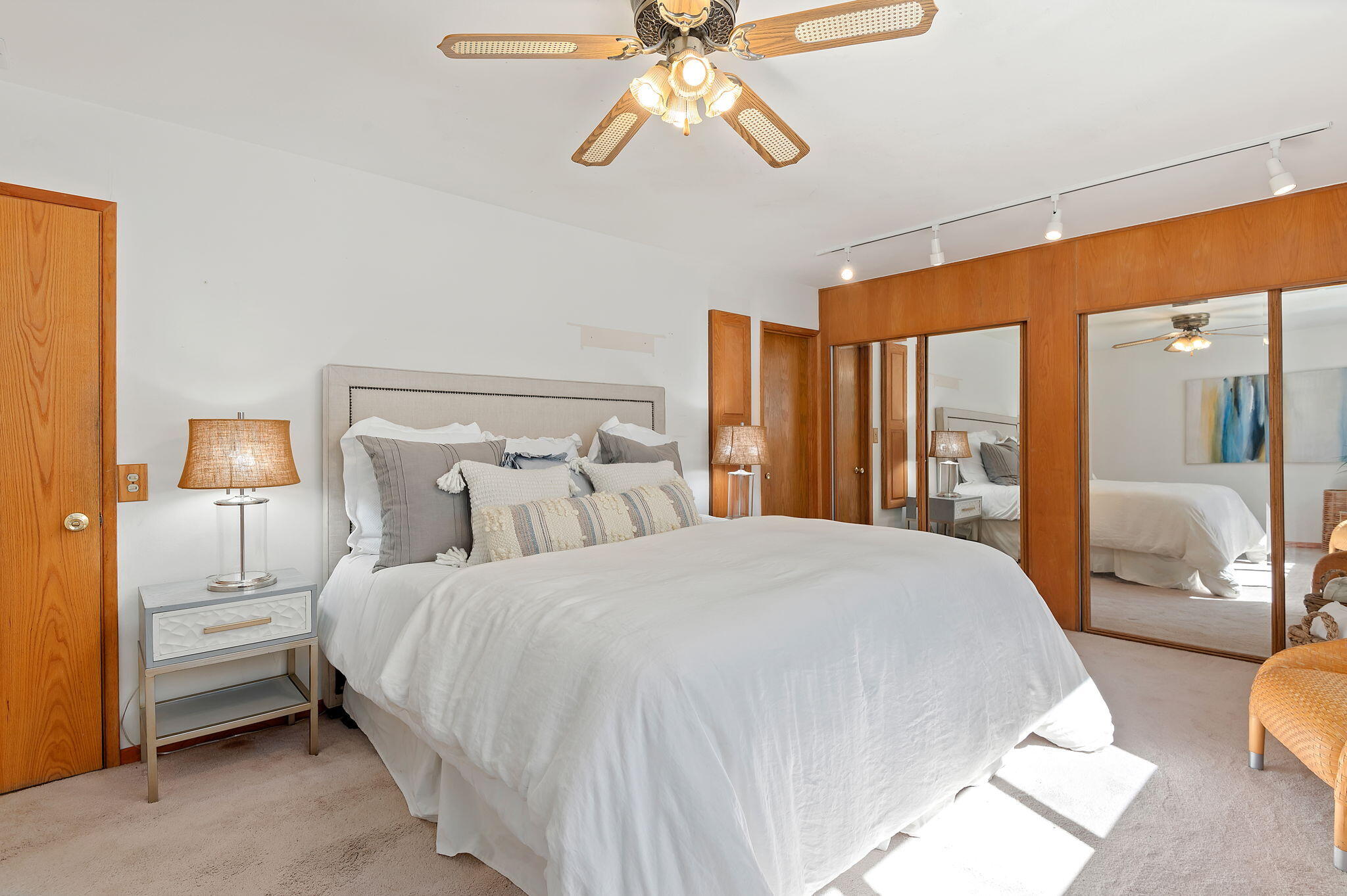 7397 Mirano Drive Goleta, CA 93117 - Photo 15 of 27 a bedroom with a large bed and a chandelier