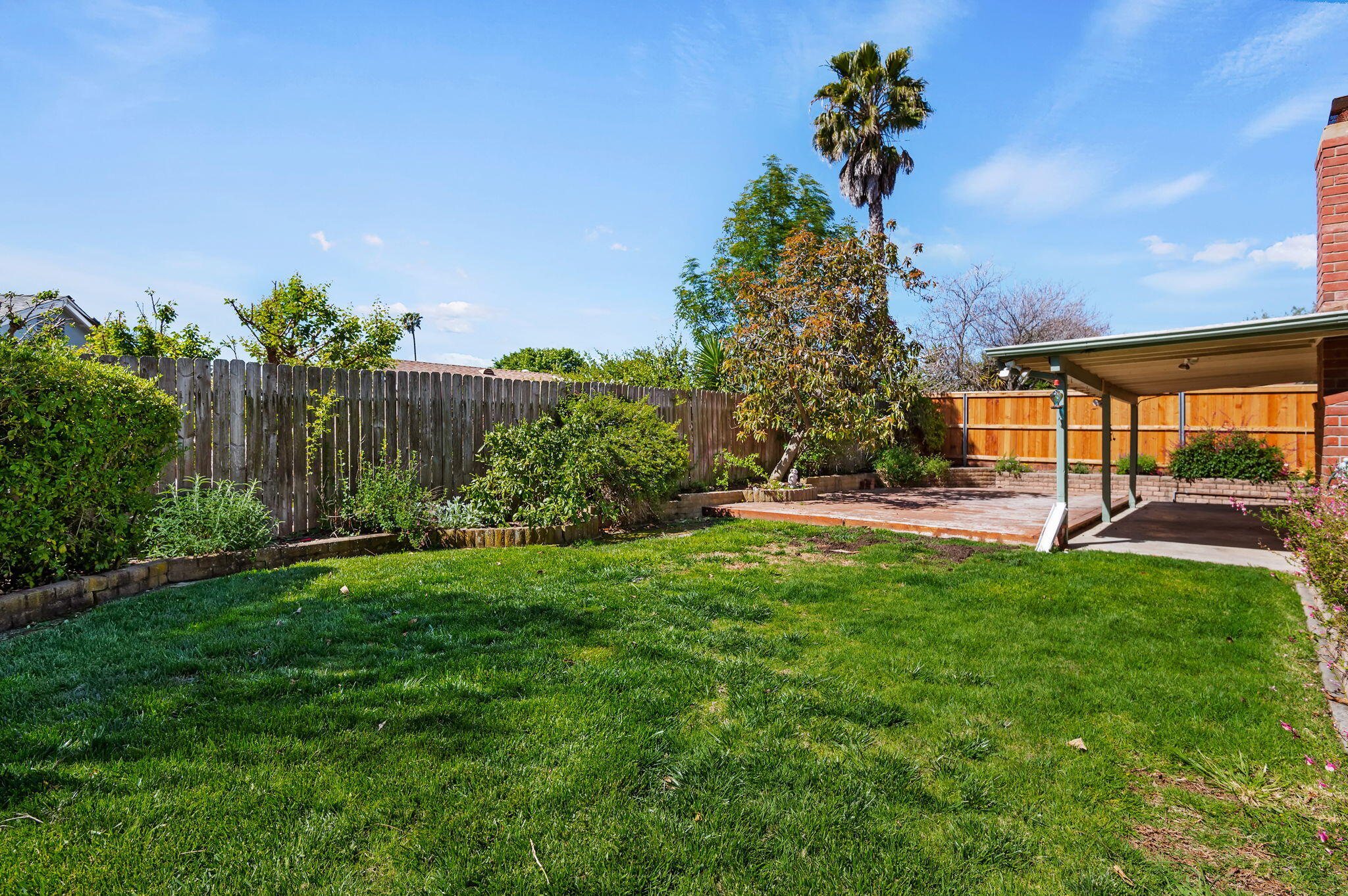 7397 Mirano Drive Goleta, CA 93117 - Photo 24 of 27 a view of a backyard with a garden