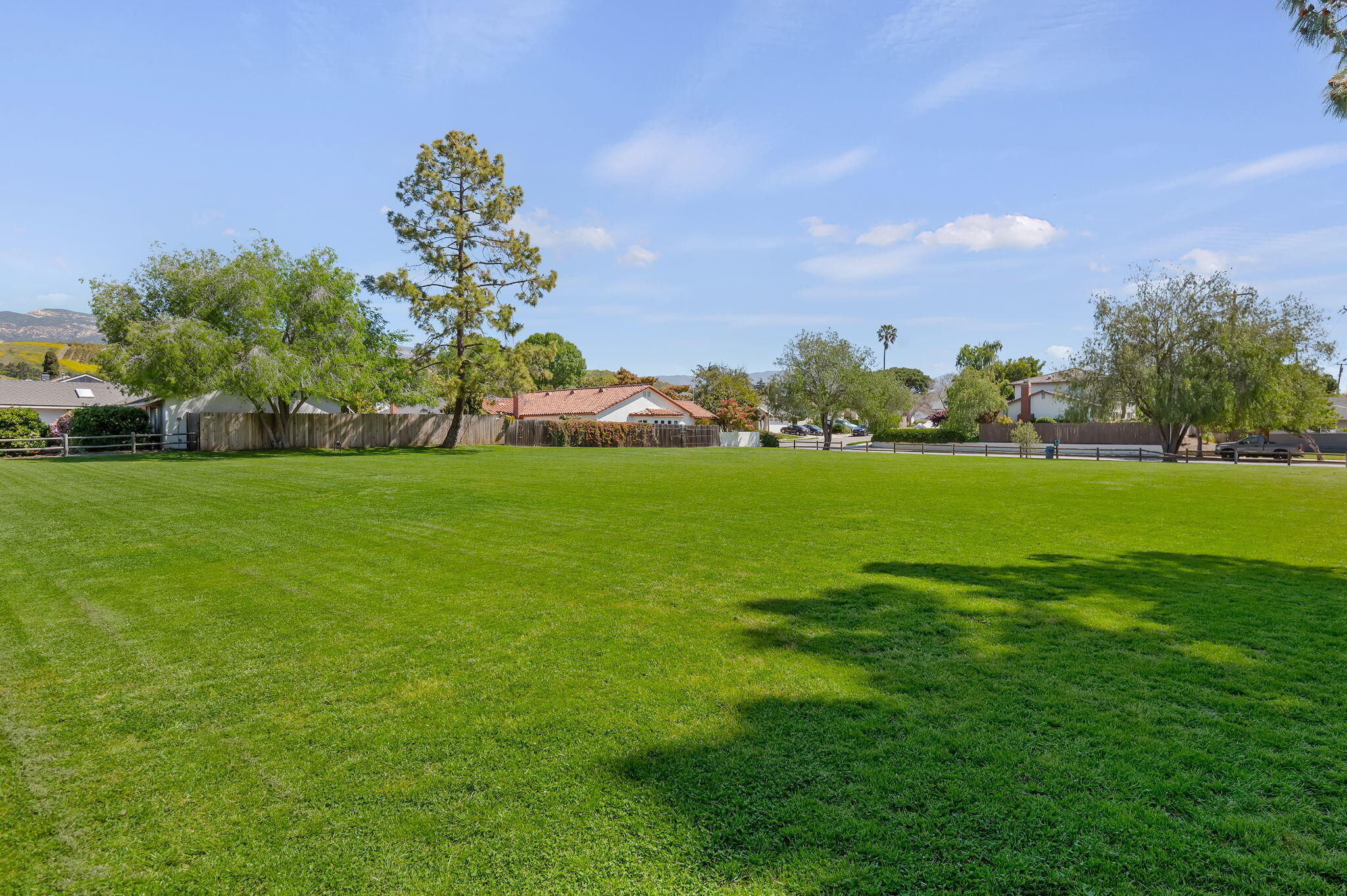 7397 Mirano Drive Goleta, CA 93117 - Photo 25 of 27 a view of a golf course with a lake