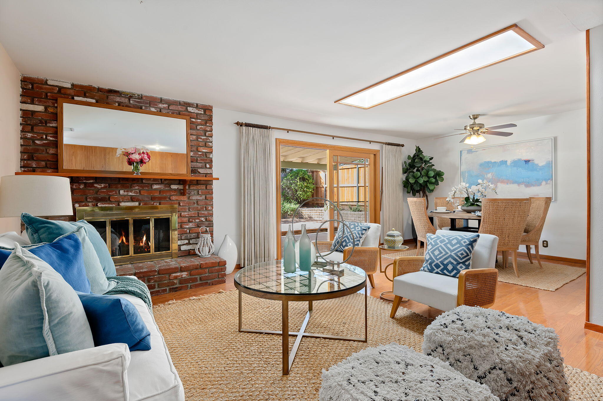 7397 Mirano Drive Goleta, CA 93117 - Photo 5 of 27 a living room with furniture a fireplace and a flat screen tv