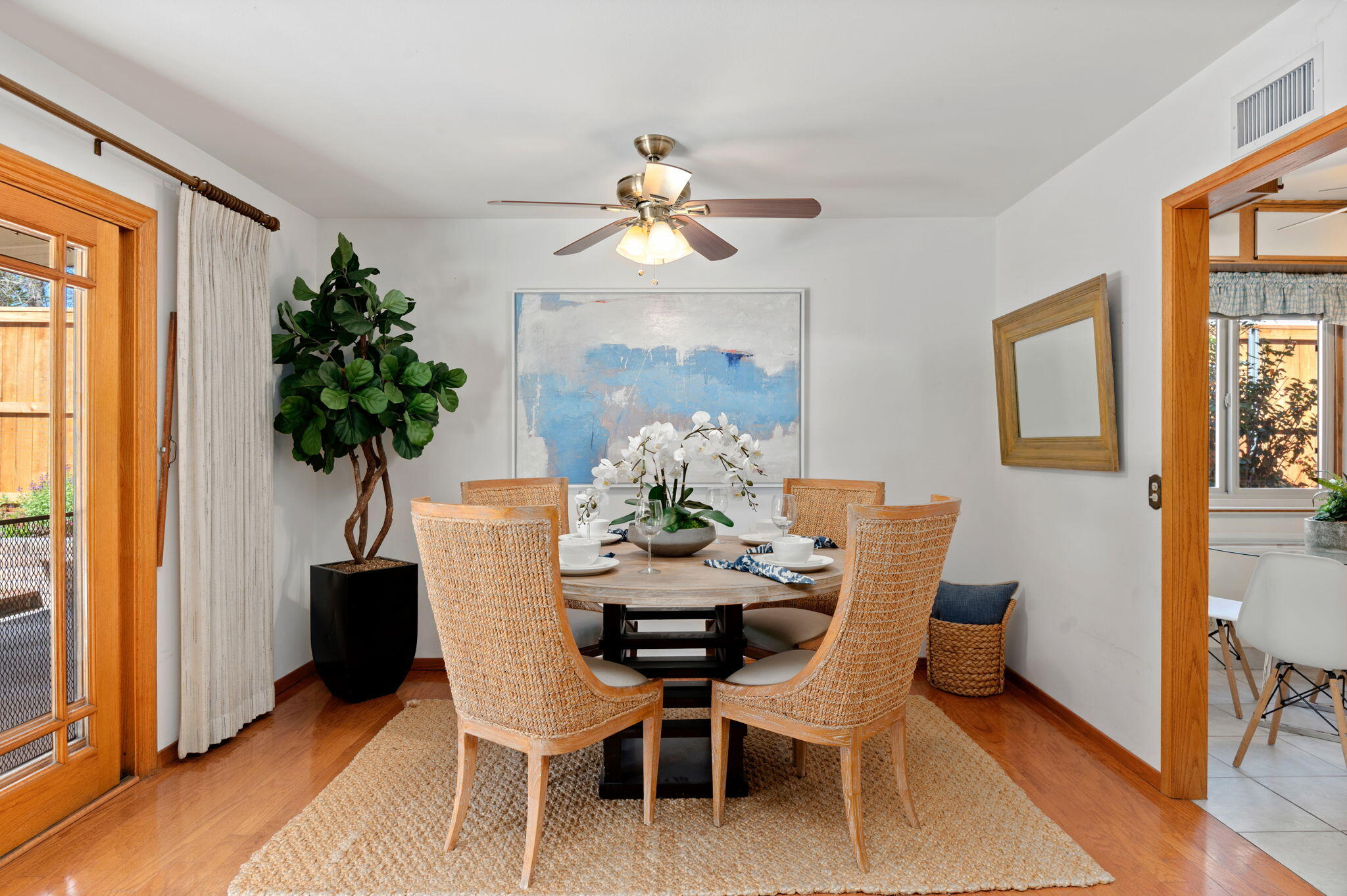 7397 Mirano Drive Goleta, CA 93117 - Photo 9 of 27 a dining room with furniture potted plants and wooden floor