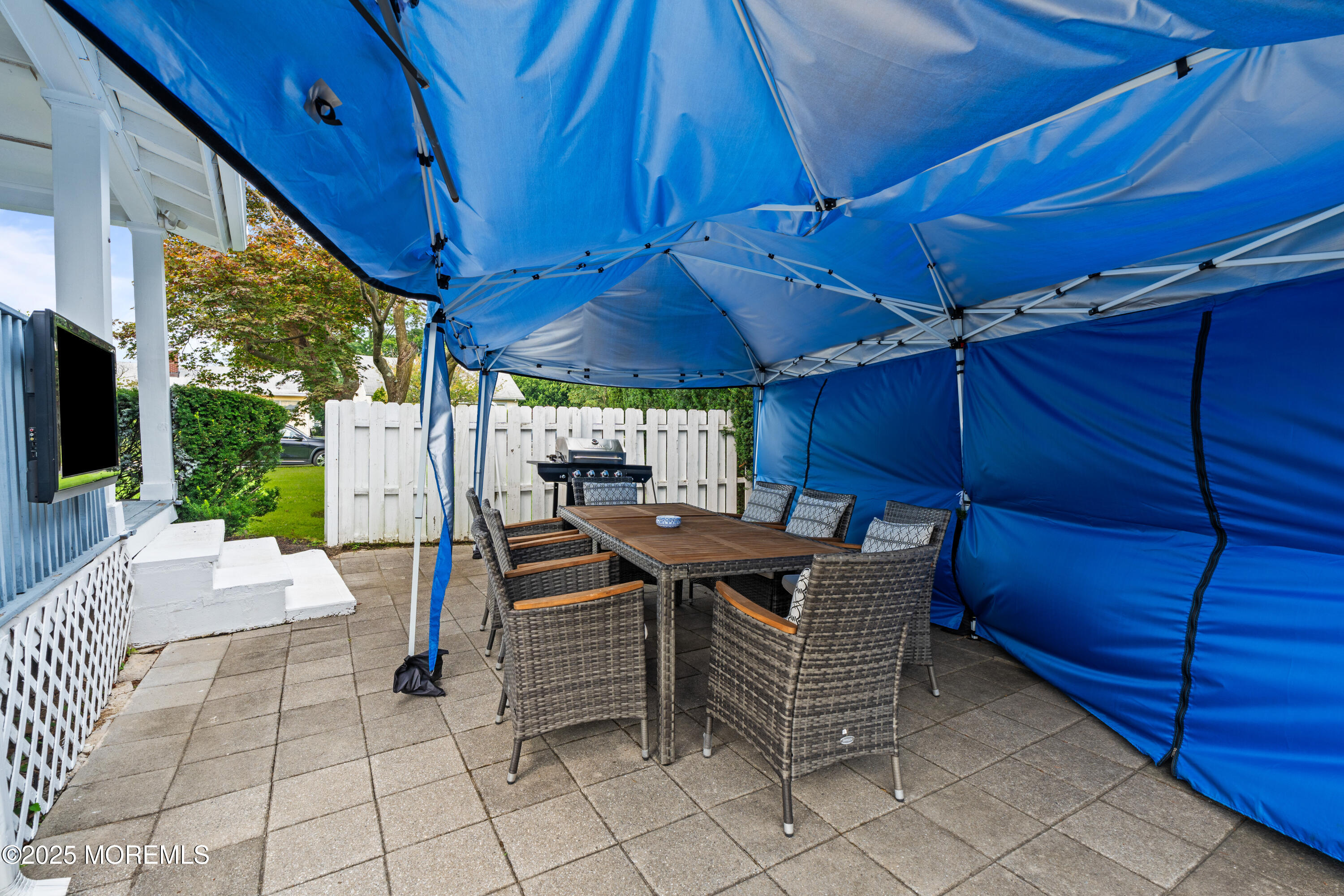 3 Reid Street Long Branch, NJ 07740 - Photo 37 of 54 a view of a patio with table and chairs with wooden floor