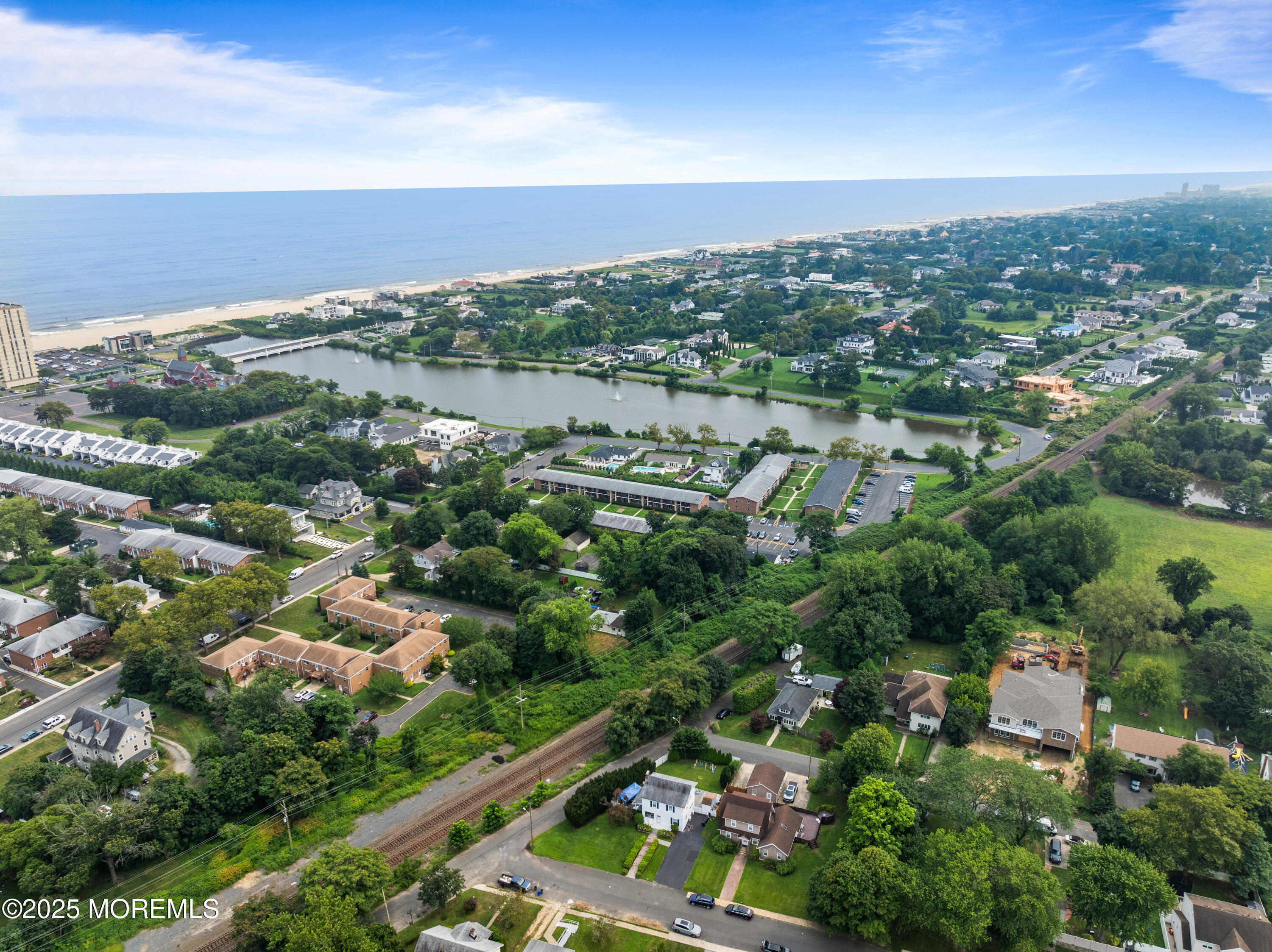3 Reid Street Long Branch, NJ 07740 - Photo 41 of 54 an aerial view of green landscape with trees houses and lake view
