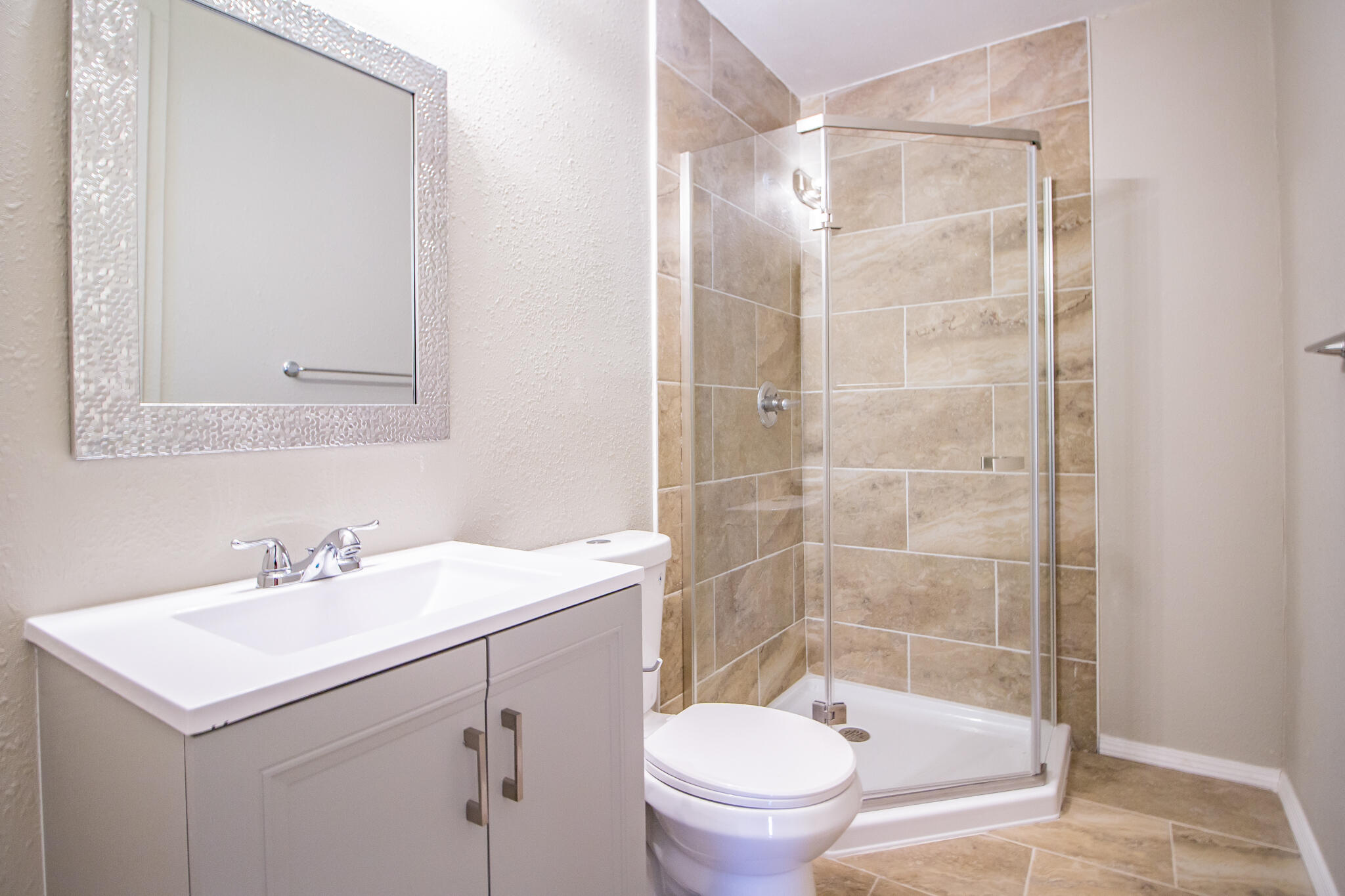 1304 42nd Street Lubbock, TX 79412 - Photo 14 of 17 a bathroom with a sink toilet and shower