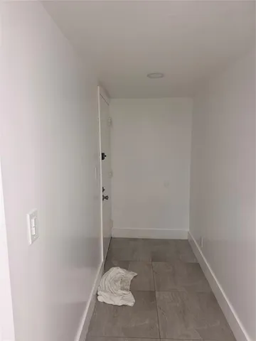 a bathroom with a sink toilet and mirror