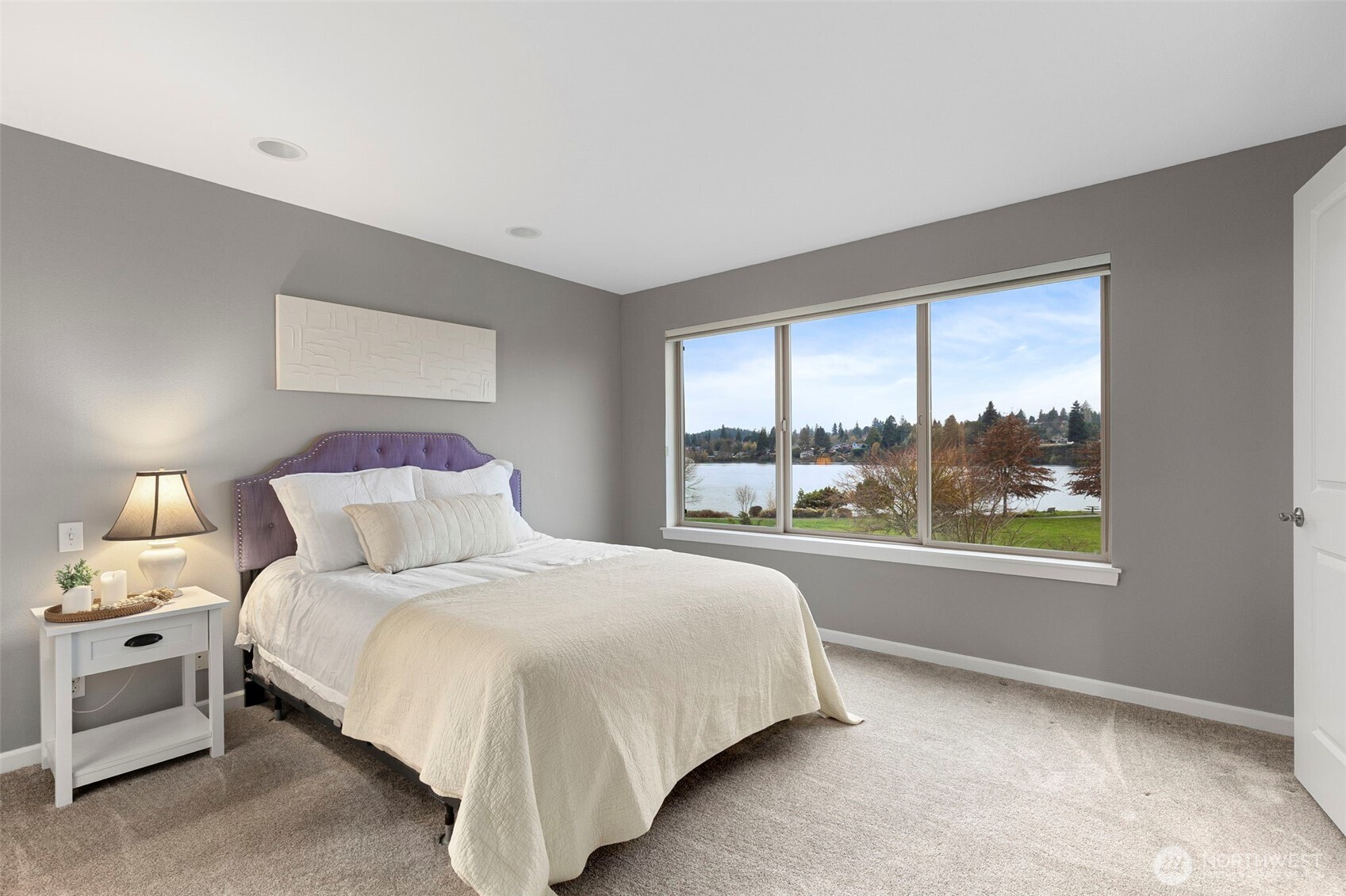 219 Apple Street Bremerton, WA 98310 - Photo 11 of 39 a bedroom with a large bed and a night stand