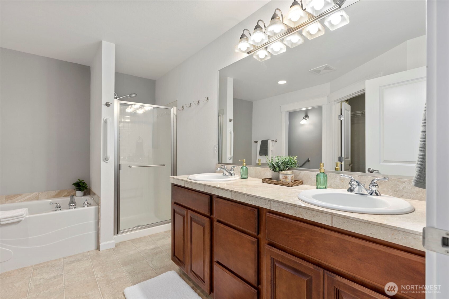 219 Apple Street Bremerton, WA 98310 - Photo 13 of 39 a bathroom with a double vanity sink mirror double and bathtub