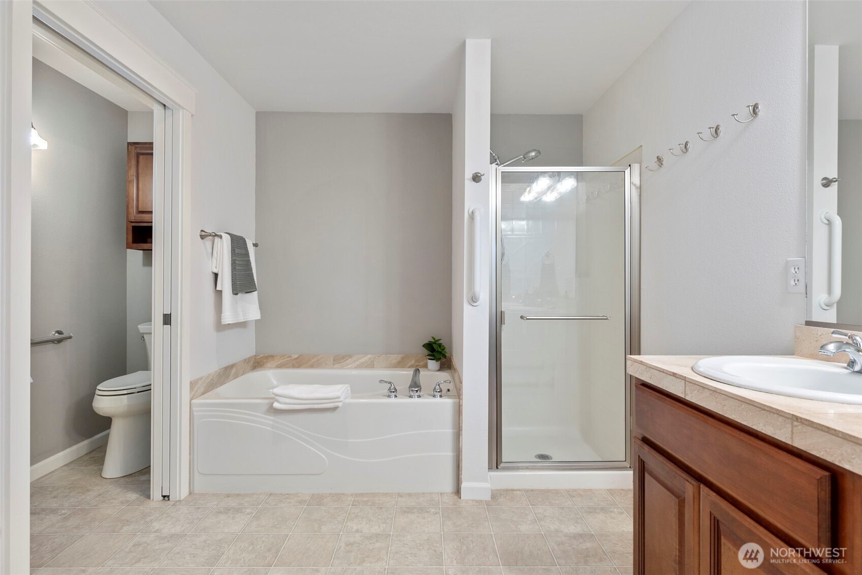 219 Apple Street Bremerton, WA 98310 - Photo 14 of 39 a bathroom with a granite countertop sink toilet and shower