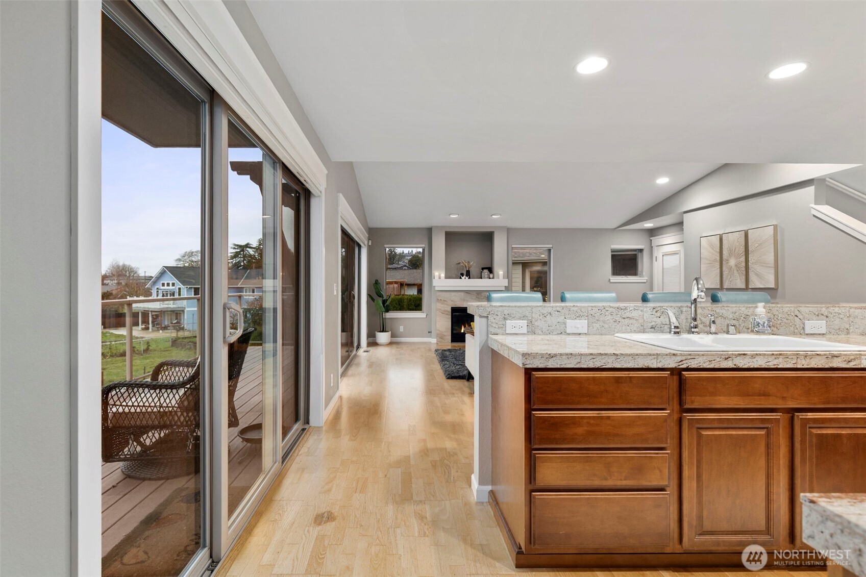 219 Apple Street Bremerton, WA 98310 - Photo 17 of 39 a living room with kitchen island granite countertop furniture and a fireplace