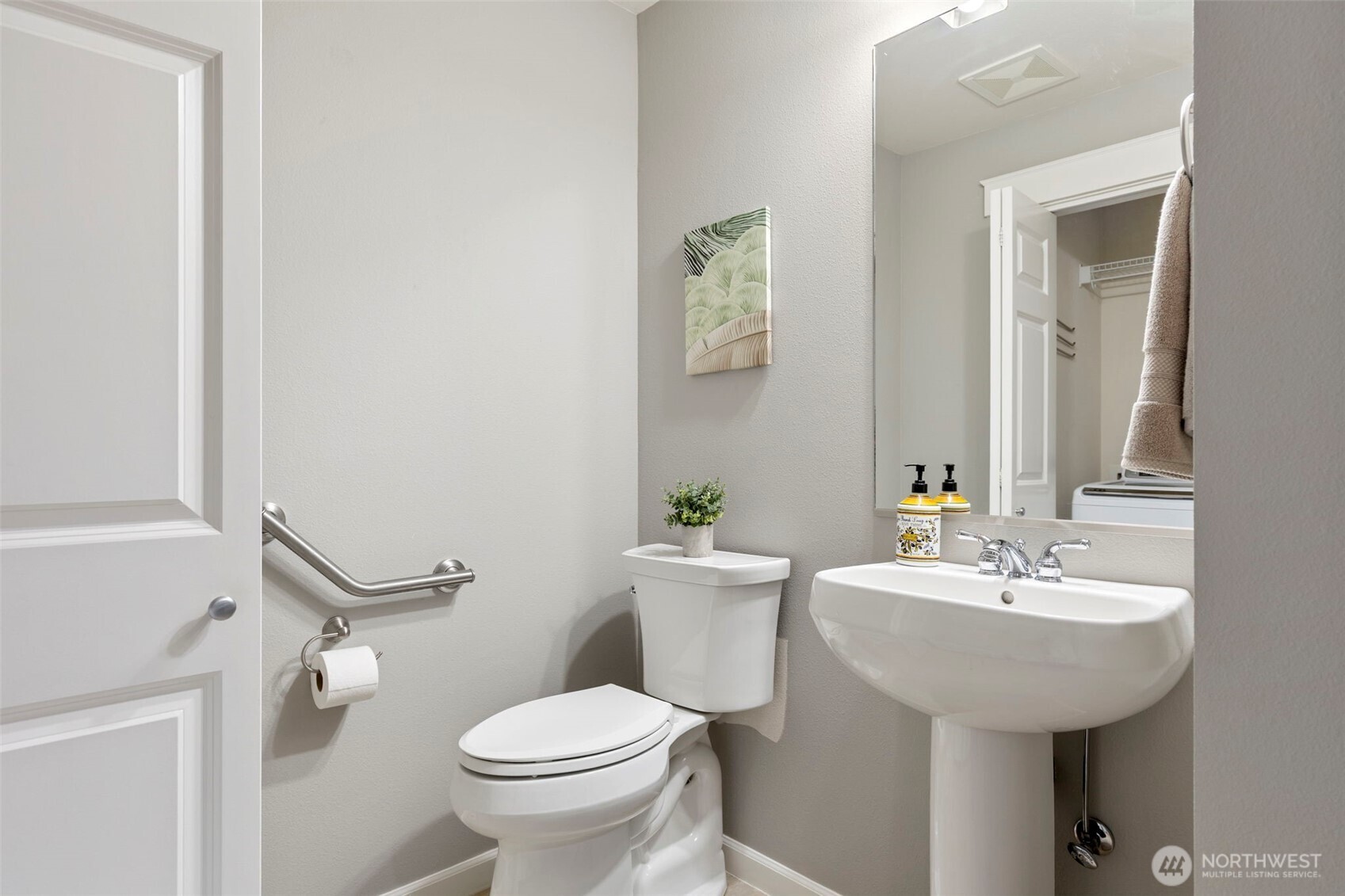 219 Apple Street Bremerton, WA 98310 - Photo 22 of 39 a bathroom with a sink toilet and a mirror
