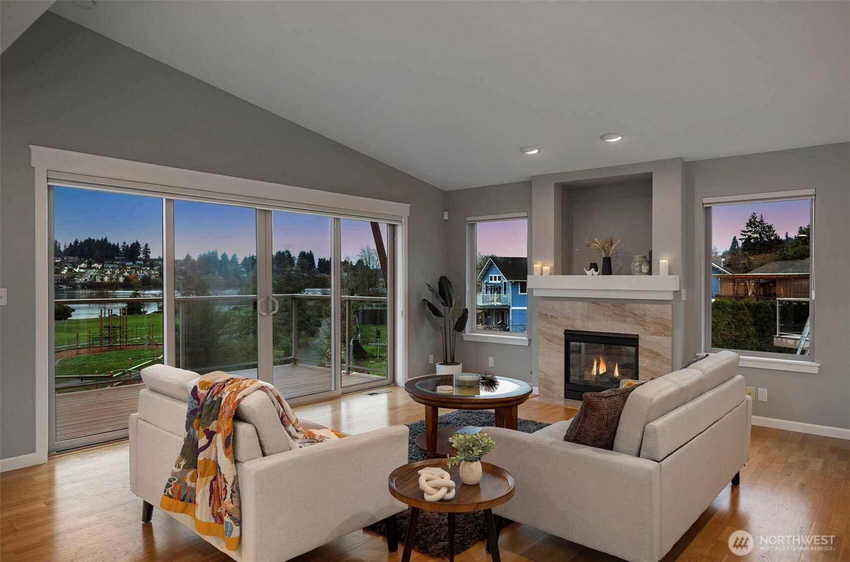219 Apple Street Bremerton, WA 98310 - Photo 37 of 39 a living room with furniture fireplace and a floor to ceiling window