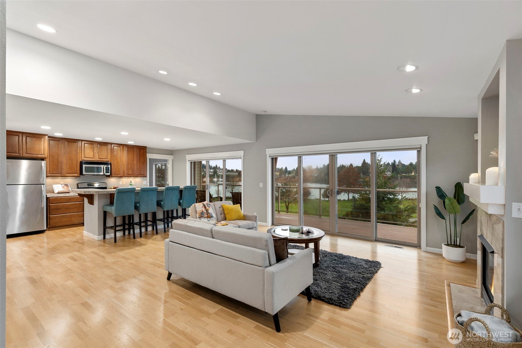 219 Apple Street Bremerton, WA 98310 - Photo 6 of 39 a living room with furniture floor to ceiling window and a kitchen view