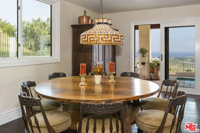 a view of a dining room with furniture window and outside view