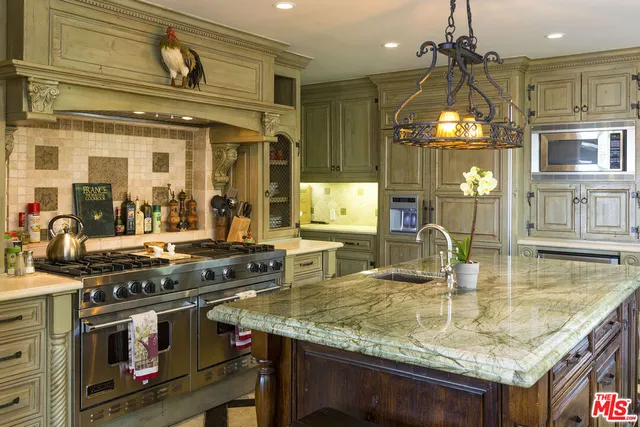 a kitchen with a stove and a sink