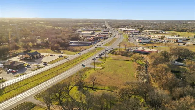 an aerial view of residential building and parking space