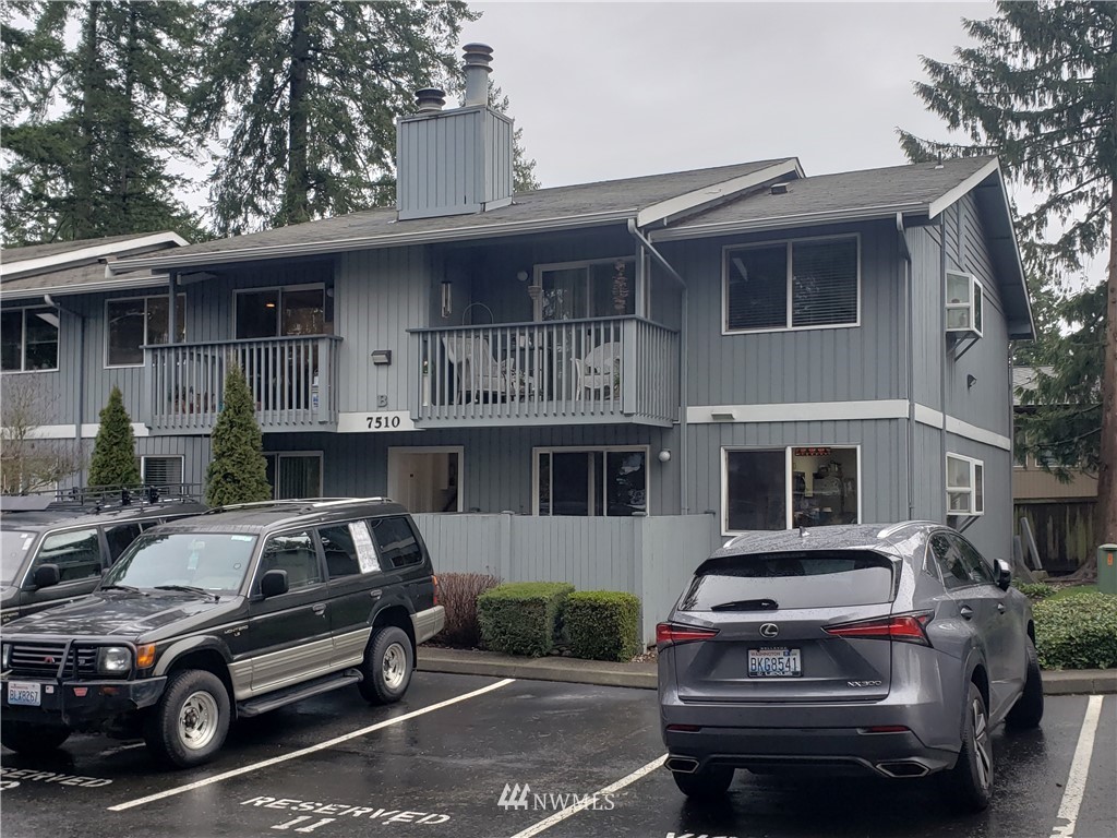 7510 208th Street Southwest, Unit B202 Edmonds, WA 98026 - Photo 1 of 13 a car parked in front of a house