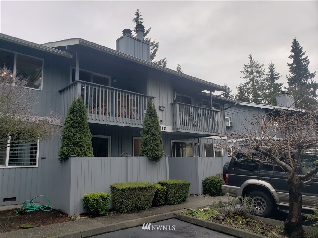 7510 208th Street Southwest, Unit B202 Edmonds, WA 98026 - Photo 2 of 13 a view of a house with a patio