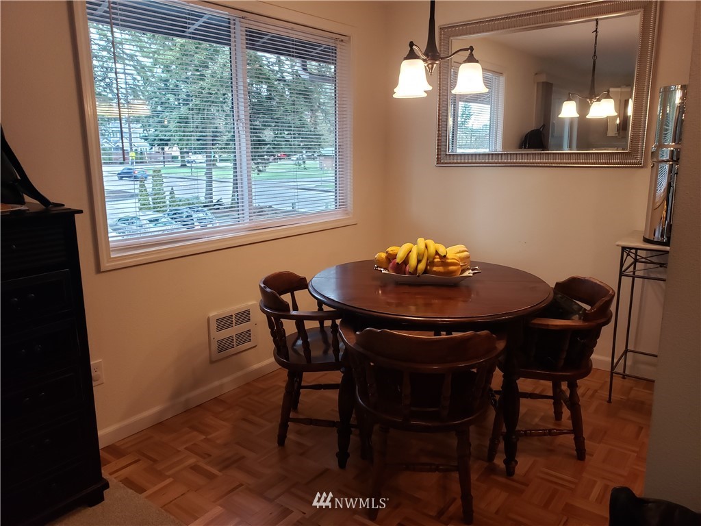 7510 208th Street Southwest, Unit B202 Edmonds, WA 98026 - Photo 6 of 13 a view of a dining room with furniture and window