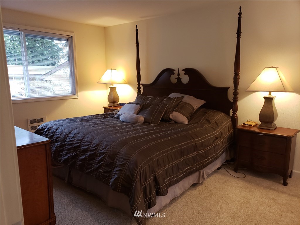 7510 208th Street Southwest, Unit B202 Edmonds, WA 98026 - Photo 7 of 13 a bedroom with a bed and window