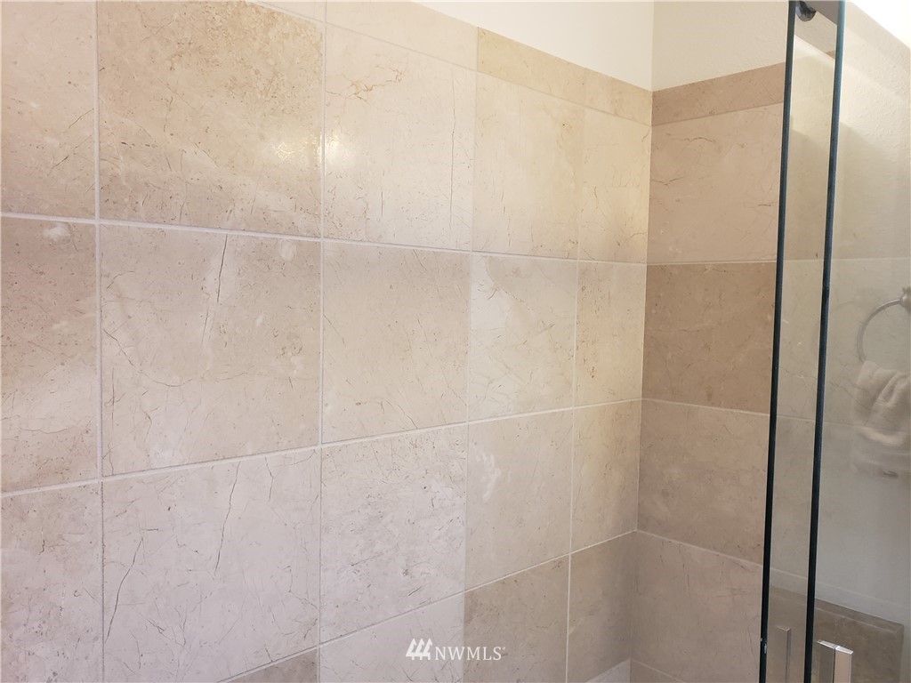 7510 208th Street Southwest, Unit B202 Edmonds, WA 98026 - Photo 9 of 13 a bathroom with a shower
