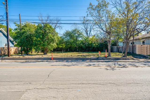 a view of a swimming pool with a yard