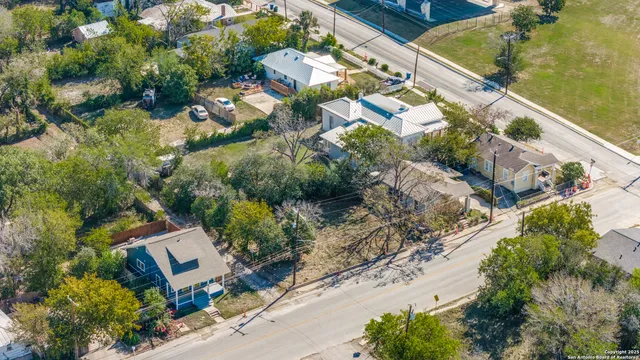 an aerial view of residential houses with outdoor space
