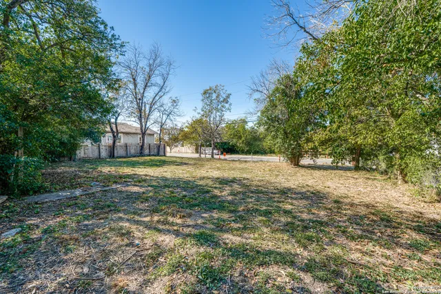 a view of outdoor space with trees all around