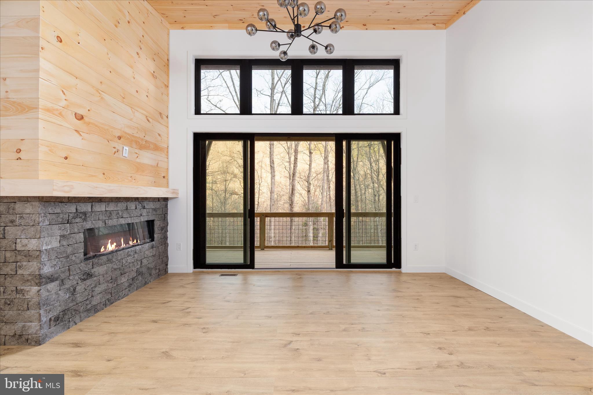 6292 Thorn Btm Road Lost City, WV 26810 - Photo 2 of 46 a view of an empty room with a fireplace and a window