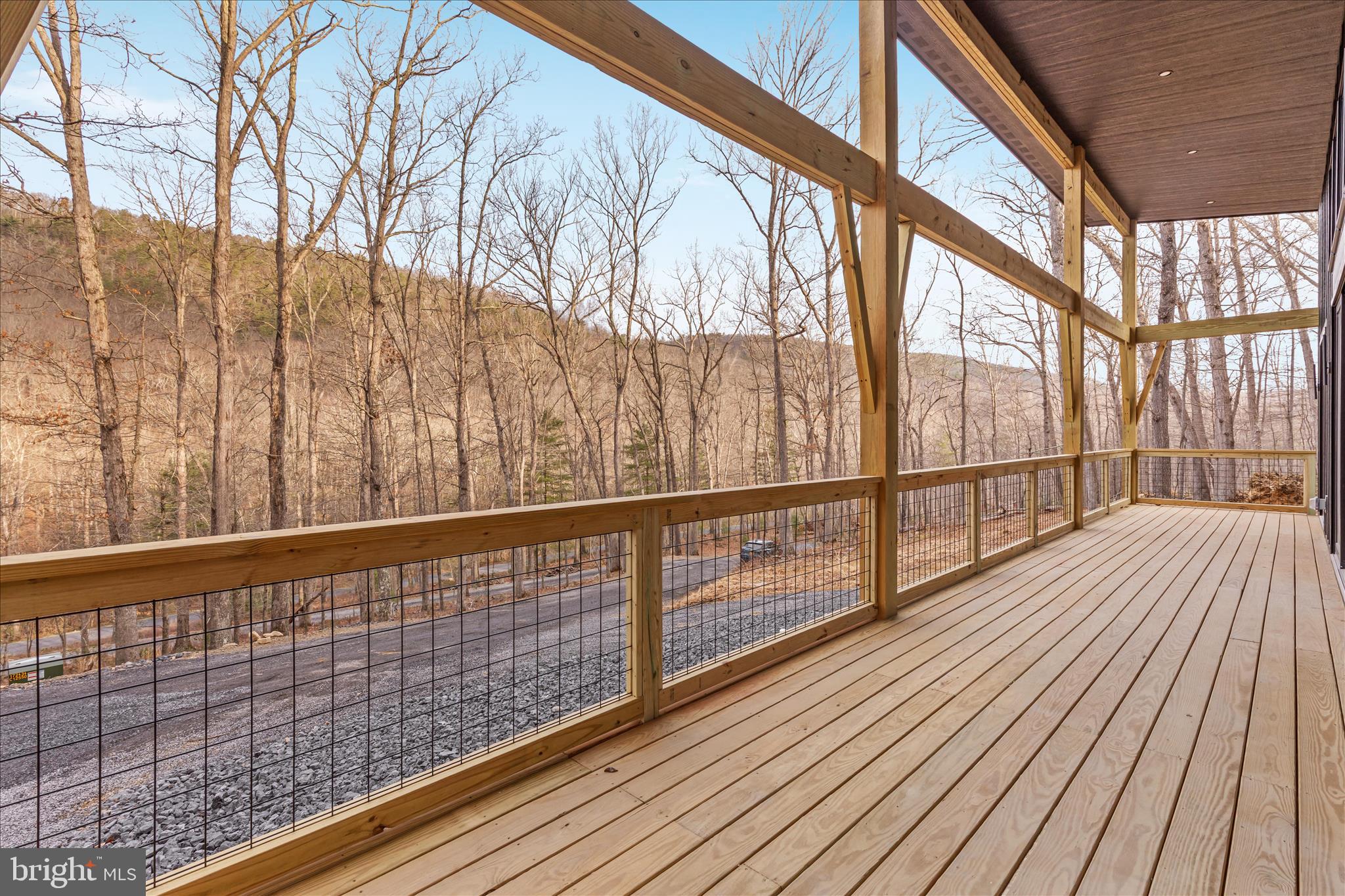 6292 Thorn Btm Road Lost City, WV 26810 - Photo 28 of 46 a view of balcony with wooden floor
