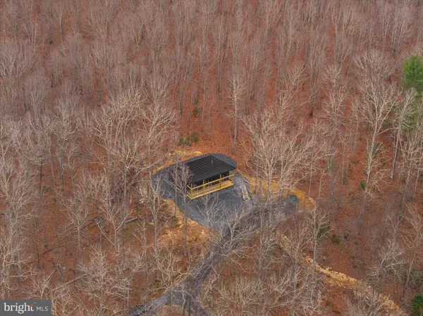 a view of a mountain range with trees in the background