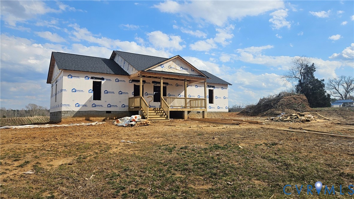 2078 East Courthouse Road Blackstone, VA 23824 - Photo 2 of 6 a view of a house with backyard and wooden fence