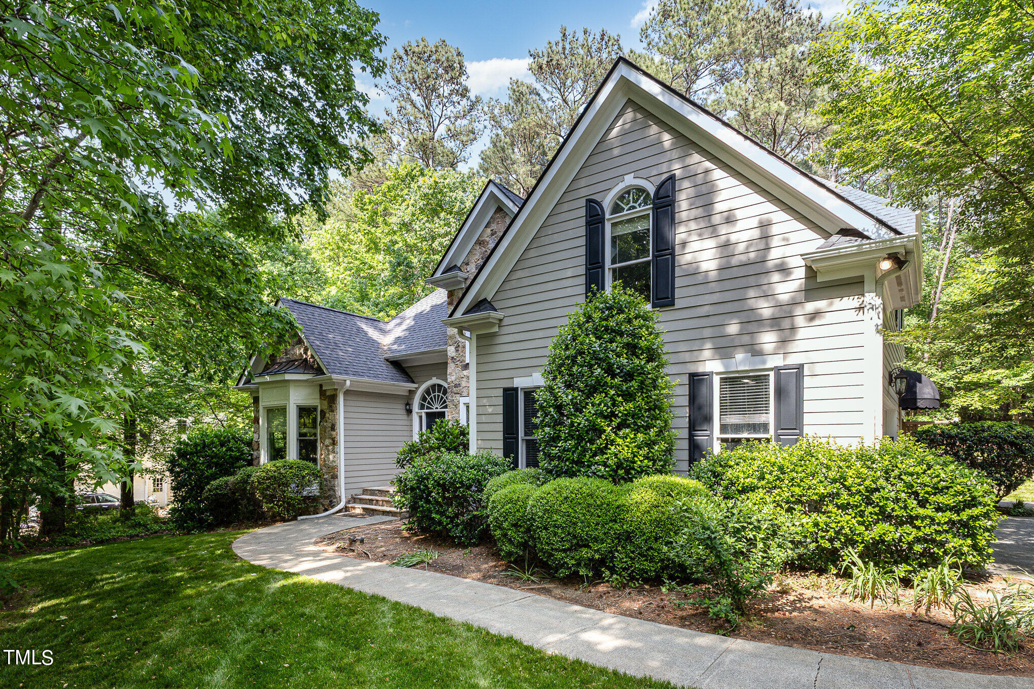 3200 Nimich Pond Way Raleigh, NC 27613 - Photo 1 of 26 a house view with a garden and large trees