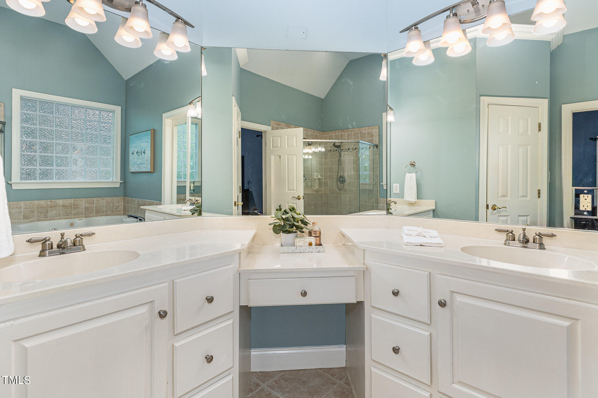 3200 Nimich Pond Way Raleigh, NC 27613 - Photo 14 of 26 a bathroom with a sink vanity and a mirror