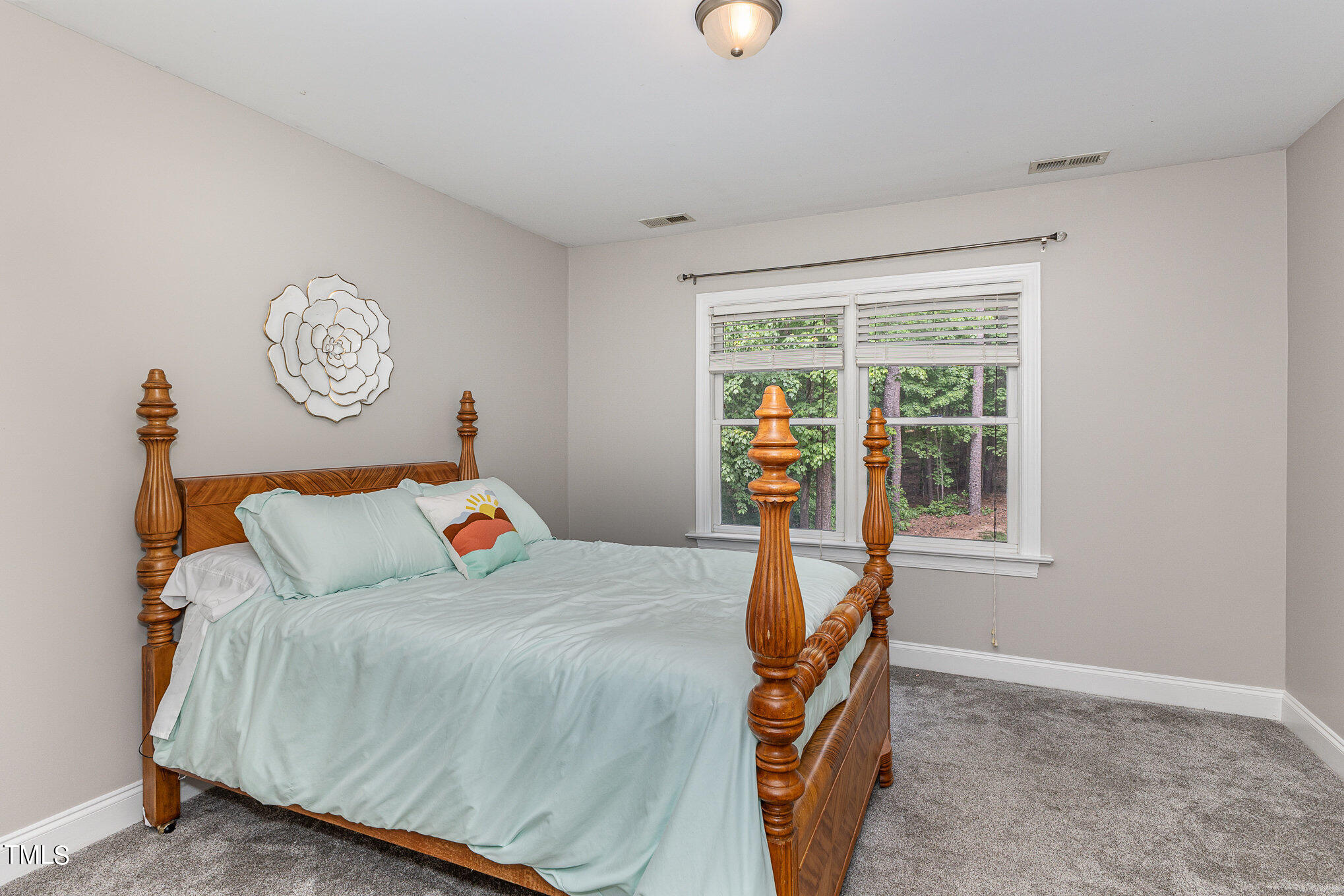 3200 Nimich Pond Way Raleigh, NC 27613 - Photo 16 of 26 a bedroom with a bed and a window