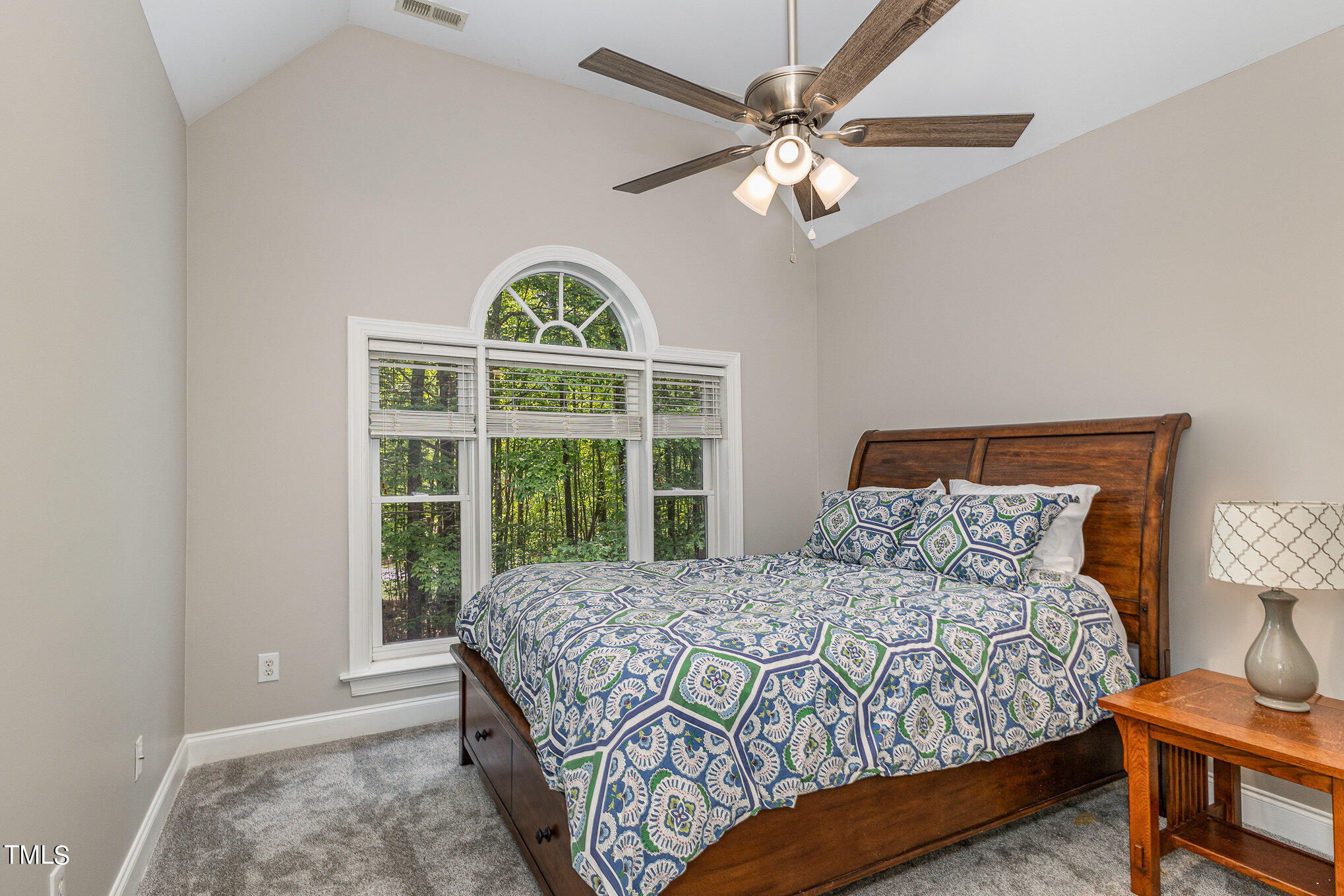 3200 Nimich Pond Way Raleigh, NC 27613 - Photo 17 of 26 a bedroom with a bed and a window