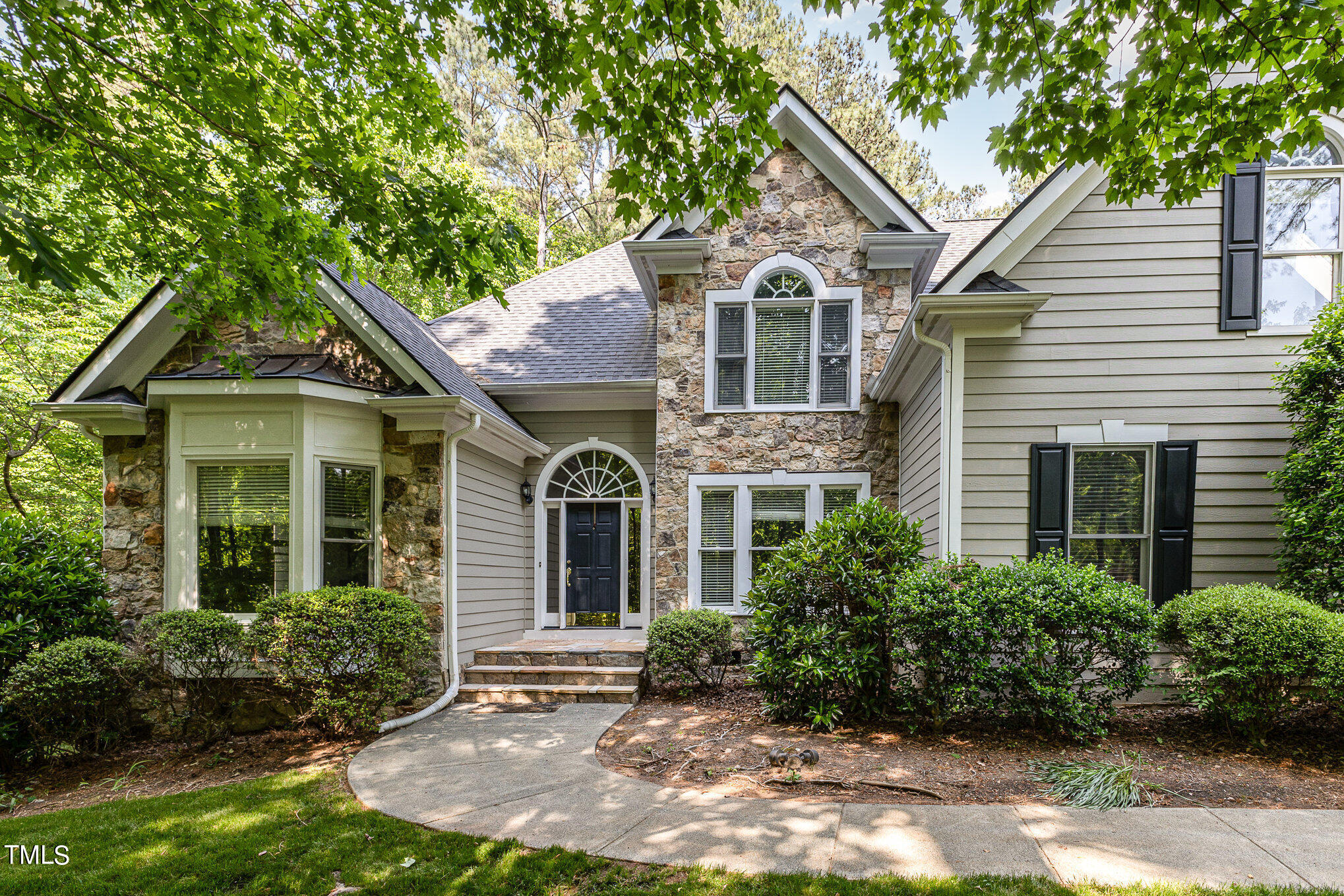 3200 Nimich Pond Way Raleigh, NC 27613 - Photo 2 of 26 a front view of a house with a yard