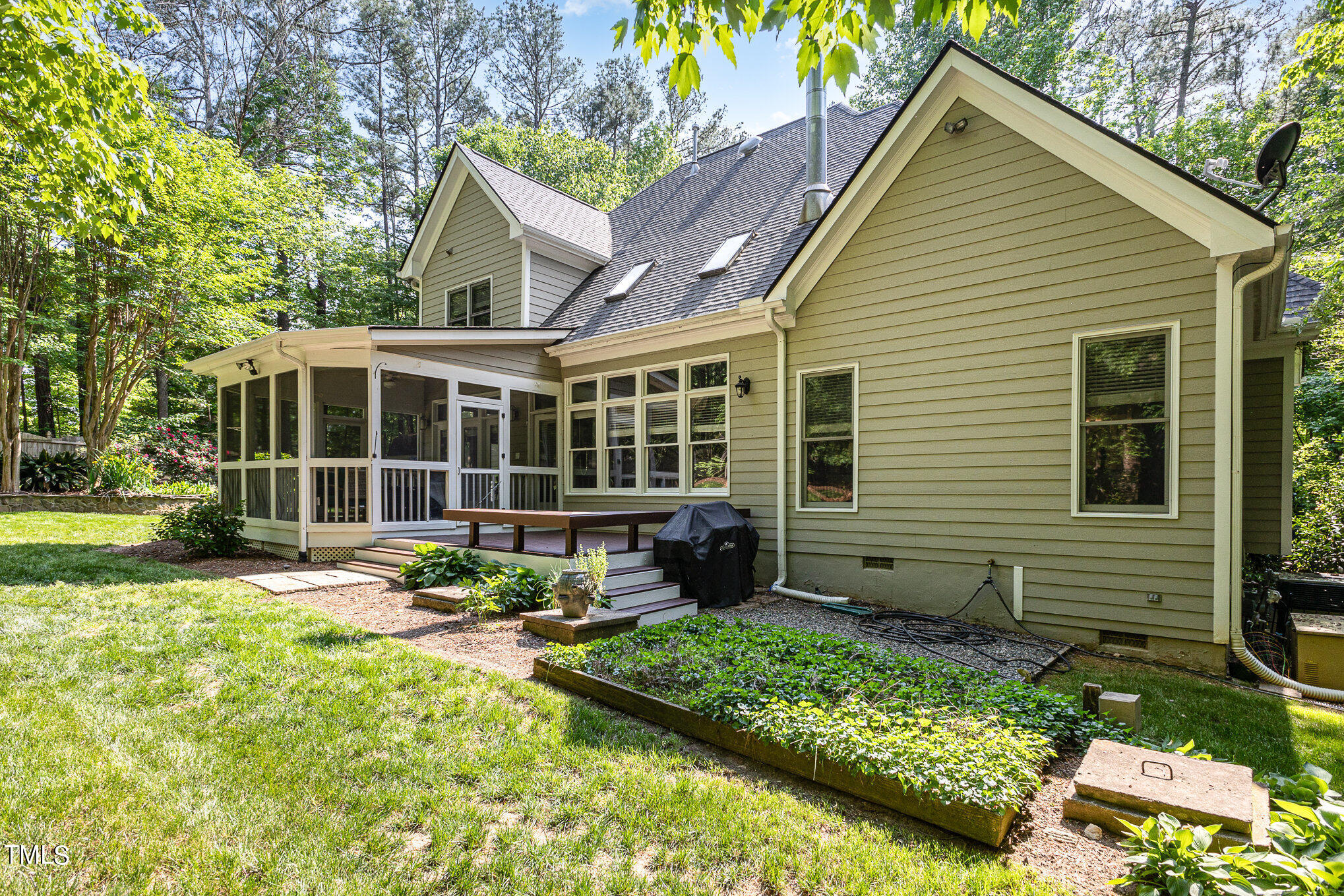 3200 Nimich Pond Way Raleigh, NC 27613 - Photo 23 of 26 a house view with a sitting space and garden space