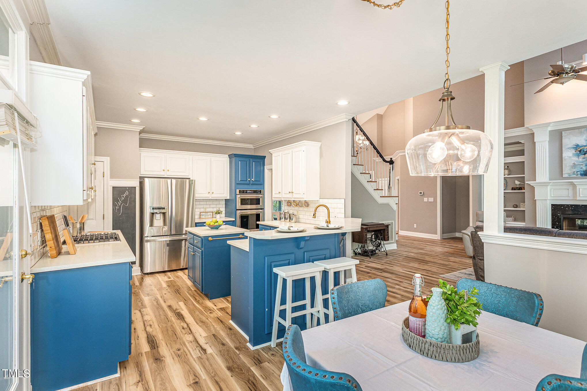 3200 Nimich Pond Way Raleigh, NC 27613 - Photo 6 of 26 a kitchen with kitchen island a large counter top space appliances and cabinets