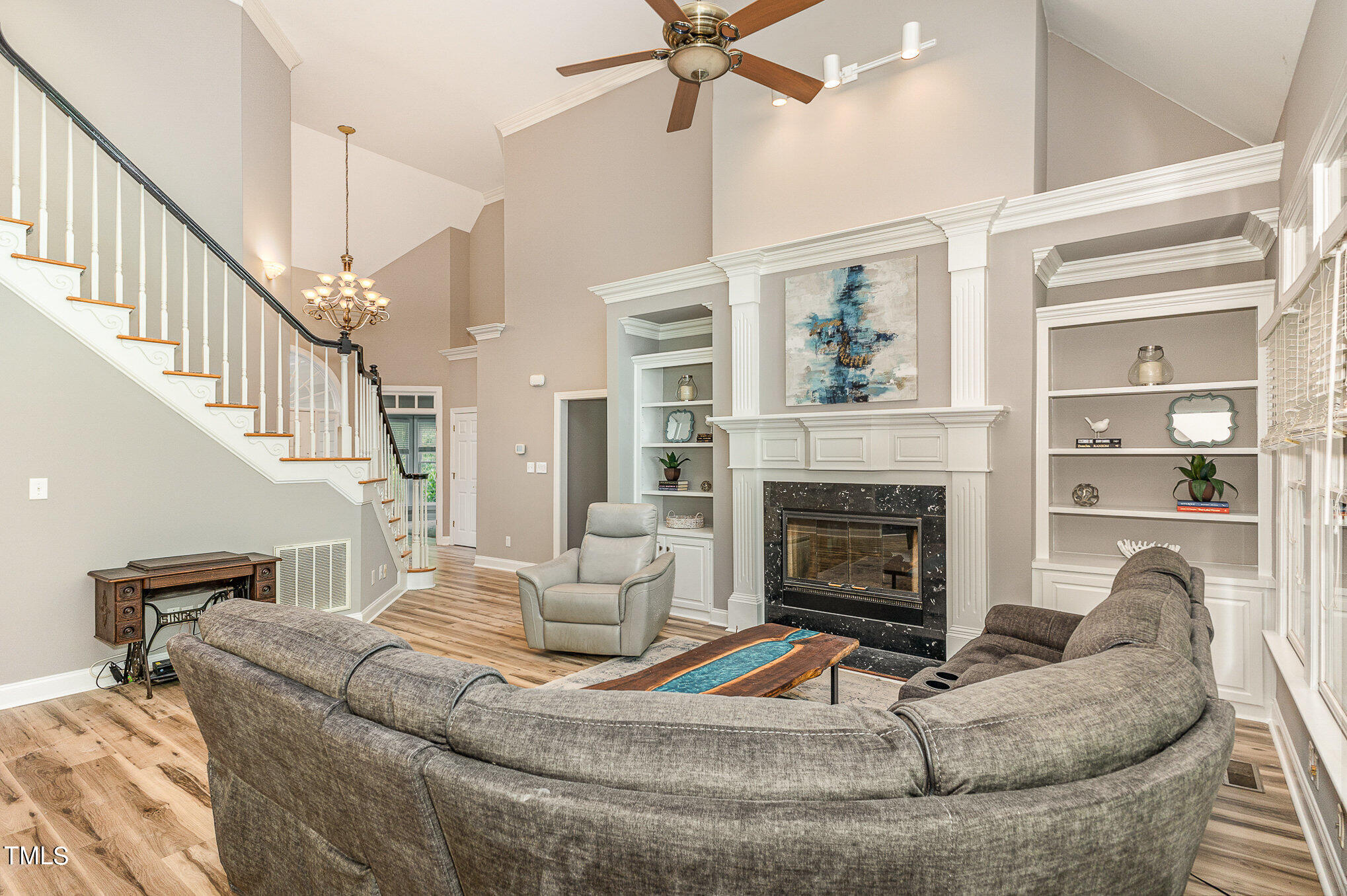 3200 Nimich Pond Way Raleigh, NC 27613 - Photo 8 of 26 a living room with furniture and a fireplace