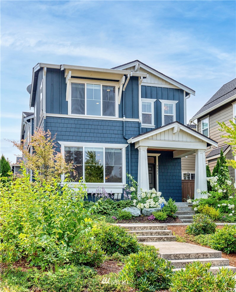 4521 185th Place Southeast Bothell, WA 98012 - Photo 2 of 33 a front view of a house with garden