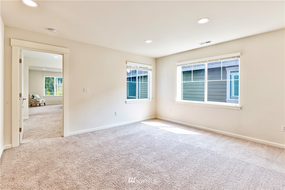 4521 185th Place Southeast Bothell, WA 98012 - Photo 12 of 33 an empty room with a empty space and windows