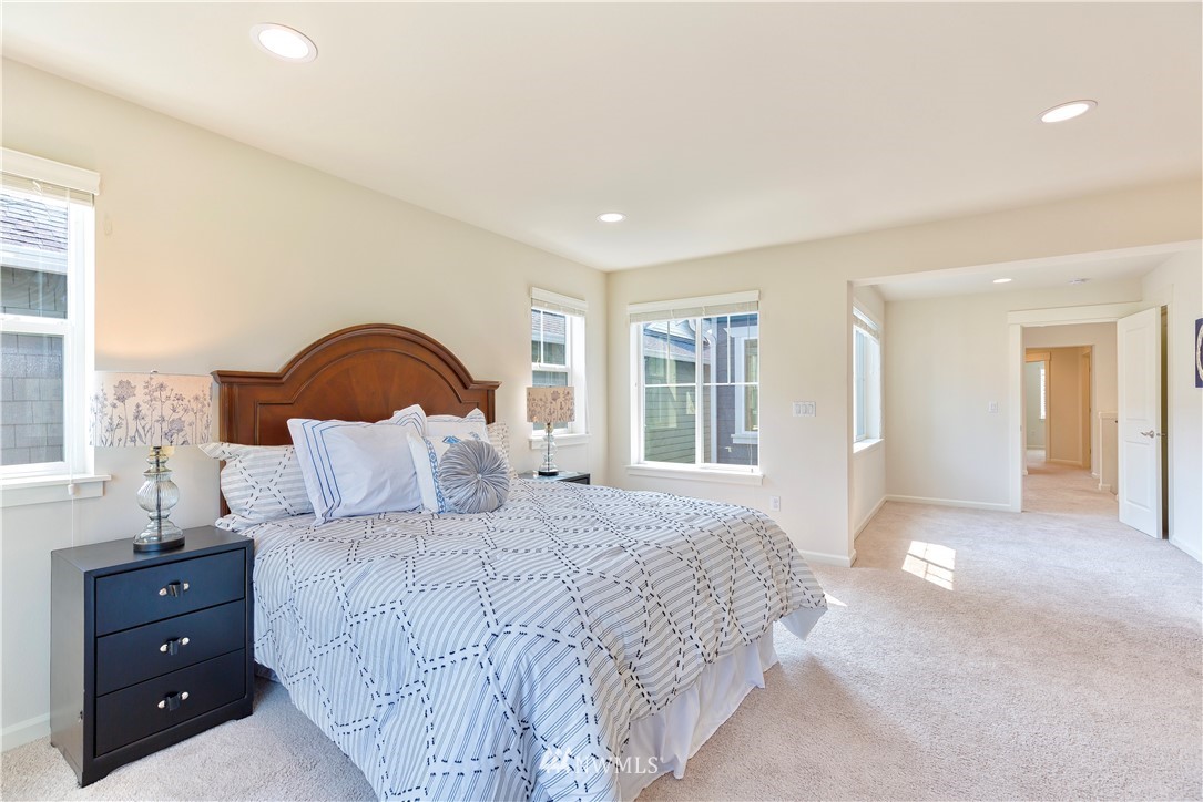 4521 185th Place Southeast Bothell, WA 98012 - Photo 18 of 33 a bedroom with a large bed and a window