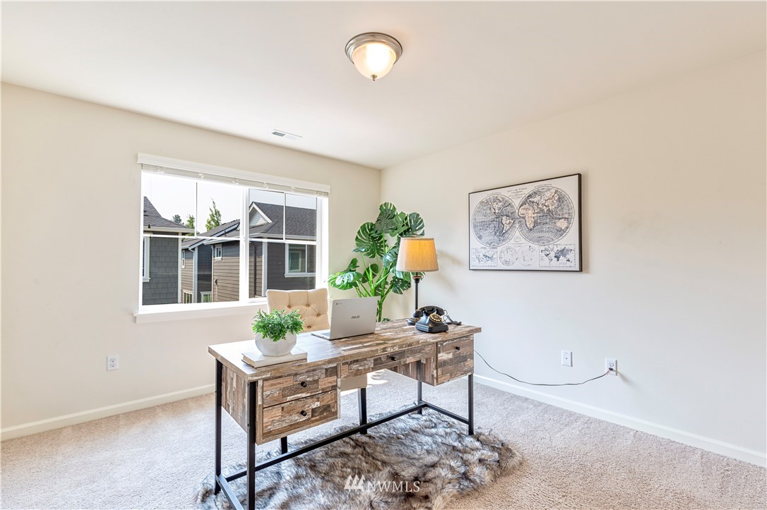 4521 185th Place Southeast Bothell, WA 98012 - Photo 22 of 33 a living room with furniture and a window