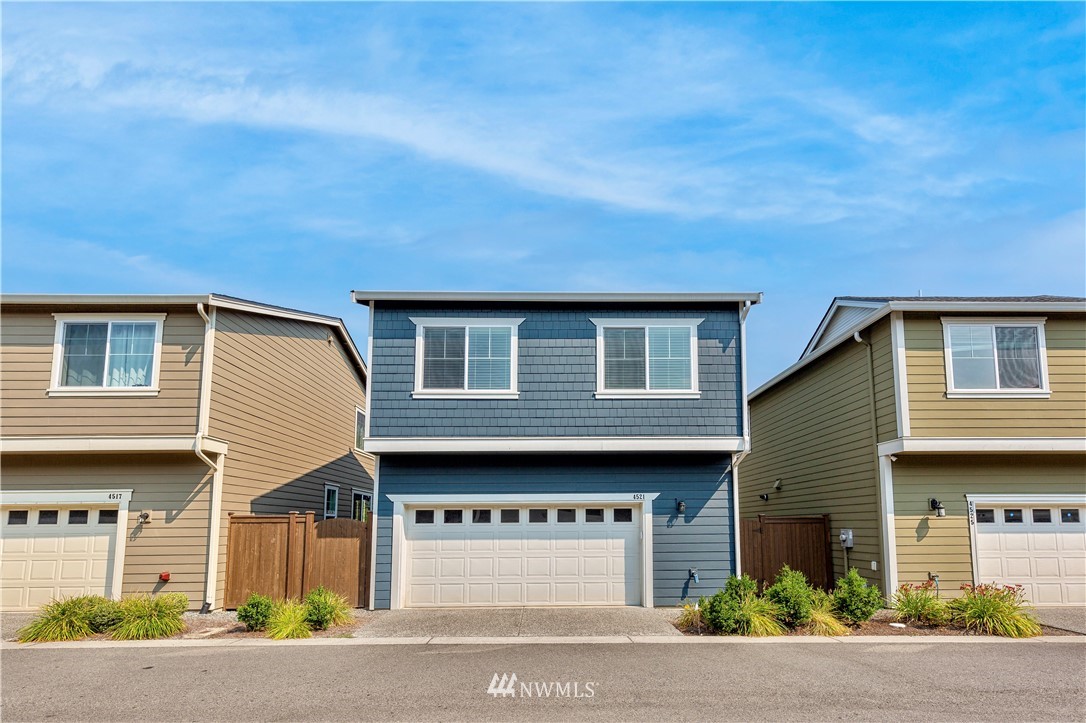 4521 185th Place Southeast Bothell, WA 98012 - Photo 25 of 33 a front view of a house with a yard