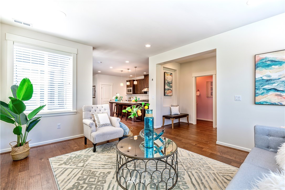 4521 185th Place Southeast Bothell, WA 98012 - Photo 4 of 33 a living room with furniture and wooden floor