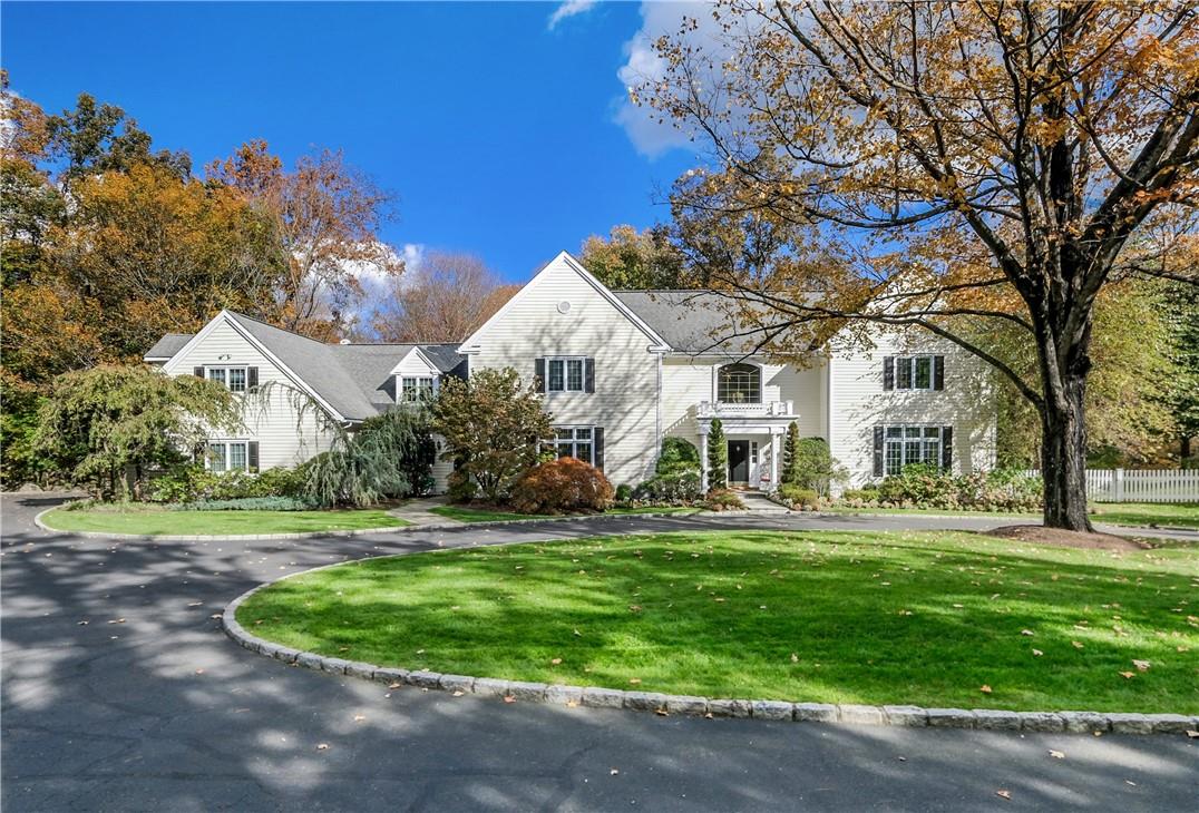 A picturesque approach provides a fitting introduction to a special residence, amid lush private grounds.