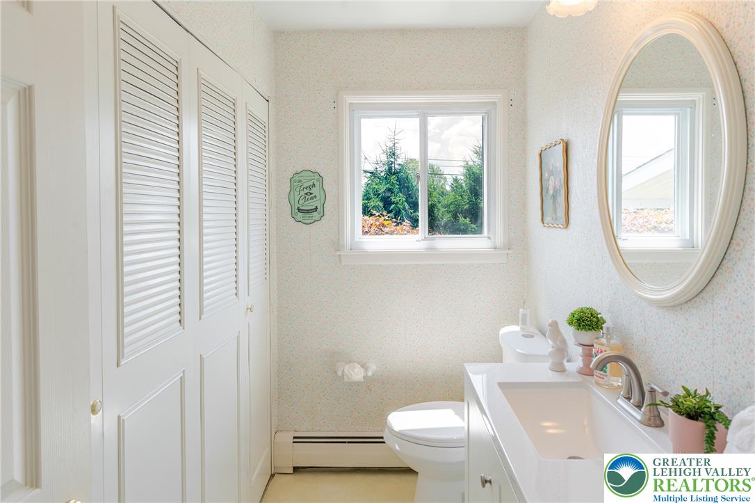 2130 Wisteria Road Lower Macungie Township, PA 18062 - Photo 19 of 48 A window-filled powder room is also the laundry room.