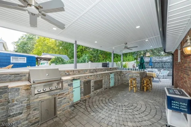 a bathroom with a shower and a sink