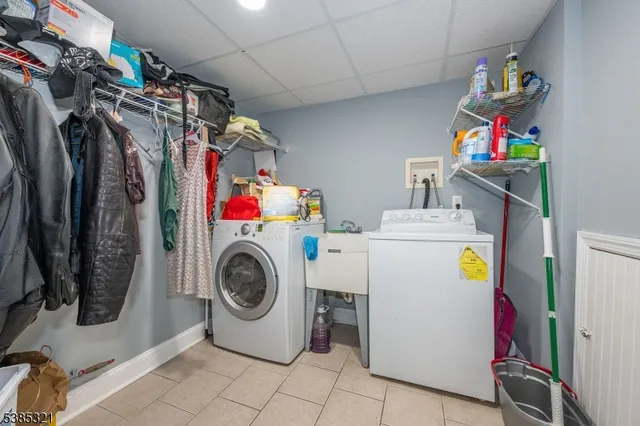 a bathroom with a sink a toilet a mirror and shower
